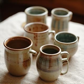 Handmade ceramic mugs by students